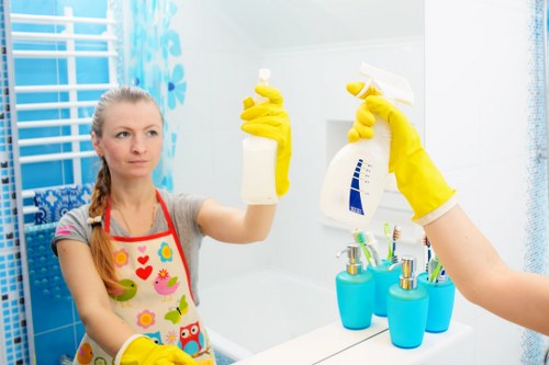 Cleaning professional starting a service visit with tools and checklist